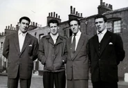 The Kray twins (left and right) with Dickie Morgan (centre right) and another associate in Bethnal Green.