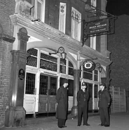 Police are pictured outside the Blind Beggar Public House, Whitechapel Road.