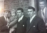 Dickie Morgan holding Gary Kray. Reggie, Ronnie and Charlie Kray are to the right, c. 1955.