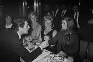 Edmund Purdom with Frances Shea at the El Morocco, a nightclub owned by the Kray Twins, in Soho, London, 30th April 1965. The Kray twins’ mother, Violet Kray, is at centre (in dark dress), sitting to her right is Dolly Kray, wife of Charlie Kray. Actress Adrienne Corri is at far left.