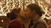 Dina and Ellie kiss.