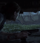 Ellie wielding a 9mm pistol