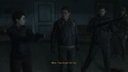 Owen holds a shotgun as Abby prepares to torture Joel.