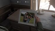 Joel and Sarah's picture preserved in his house, seen in Part II.