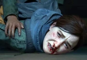 Ellie is pinned to the floor as she watches Joel die.