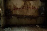 The Fireflies slogan in Ellie's room.
