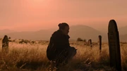 Ellie visiting Joel's grave.