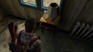 The note sitting on a lamp stand.