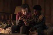 Sam and Ellie read Savage Starlight together.