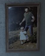 Photo of Joel with Sarah as a young child.