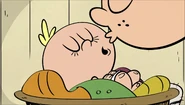 Lincoln kissing Lily goodnight.