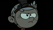Lincoln puts on night vision googles.