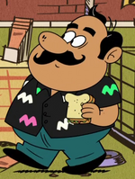 Hector wearing a black shirt with pink and green shapes.png