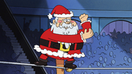 S7E13B Santa Claus runs over to the corner of the arena and climbs onto the ropes