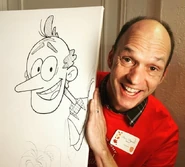 Brian Stepanek holding a drawing of Lynn Sr.