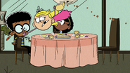 S5E22A Lola shoves a crepe up Clyde's mouth