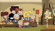Luan's shirt is yellow instead of white.