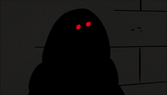 A dark figure.
