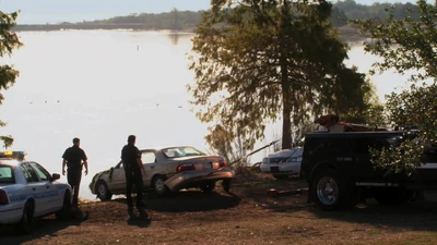 Scottsdale police haul the Mercer car out of the lake.