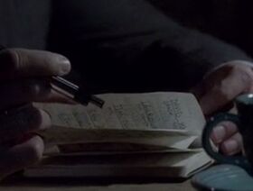 Jane reading the handbook