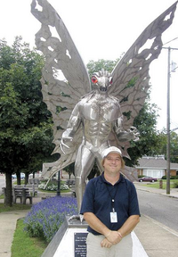 Jeff Wamsley with the statue