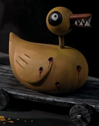 Fanged toy duck during making Christmas