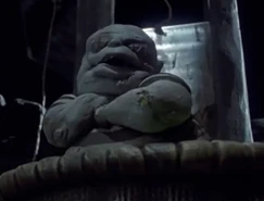 Corpse Kid under the guillotine