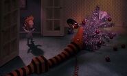 The snake eating the Christmas tree as the kid screams while watching