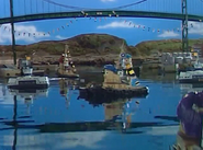 Benjamin Bridge decorated with flags as Hank, Emily, Foduck and Phillip and Filmore float across the Big Harbour