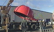 Once the head, cabin, and smokestack are loaded on the rear section of the truck, Theodore's cap is loaded on the front.