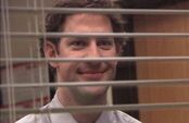 Jim Halpert smiling through blinds