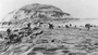 5th Division Marines land on RED and GREEN Beaches at the foot of Mount Suribachi under heavy fire coming from enemy positions overlooking the black sand terraces. The 28th Marines had not yet wheeled to the left towards Suribachi.