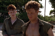 Eugene Sledge and Phillips on the beach on Pavuvu