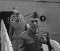 20 June 1942-Wellington Harbor, New Zealand. MajGen A. A. Vandegrift, CG, 1st MarDiv, (wearing overcoat) and BrigGen William Rupertus, ADC, 1st MarDiv, (foreground) debark from the USS Wakefield (AP-21). Still image from USMC motion picture film