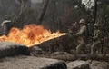 600px-Pac06 011.jpg (369 KB) Womack firing his flamethrower, to his rear is his assistant
