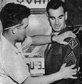 Sgt Lloyd Crusan was part of the first group of Old Breed Marines to rotate home in 1944 after over two years in the Pacific. he was a veteran of the campaigns for Guadalcanal and Cape Gloucester and earned the Navy Cross in January 1944. Here Crusan is being fitted for a new set of dress greens at MCB, San Diego. The tailor is checking the position of the First Marine Division patch and rank insignia. Leatherneck Magazine