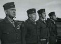 First Marine Division Medal of Honor ceremony at Balcombe, Australia, 21 May 1943. In this photo are the first Marines of the Division to receive America's highest honor in World War II. L-R: MajGen A. A. Vandegrift, Col Merritt Edson, 2ndLt Mitchell Paige, PltSgt John Basilone USMC Photo