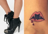 Her ninth tattoo is a mouth with vampire fangs and little upside hearts instead of drops of blood. She got the tattoo on October 13, 2017, from artist Romeo Lacoste. It is inspired by Interview with the Vampire is one of her favorite movies.