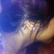 Her first tattoo was three music notes behind her ear.