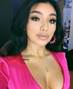 Tattoo on her collarbone