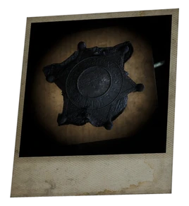 Charred sheriffs badge