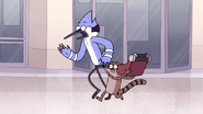 S8E23.379 Rigby Going to Throw the Typewriter at the Elevator