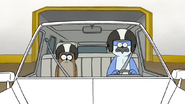 S4E21.121 Mordecai and Rigby Wearing Helmets in the Limo