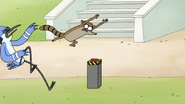 S8E01.027 Rigby Leaping Towards the Button