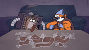 S7E09.328 Mordecai and Rigby Unwrapping the Chocolate Body Parts