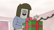 S6E09.033 Muscle Man About to Open the Last Gift