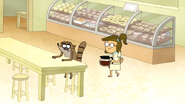 S6E06.088 Rigby Sitting at a Table