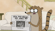 S7E24.009 Rigby Holding a Newspaper