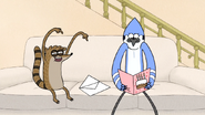 S7E06.024 Rigby Giving Mordecai a Birthday Card