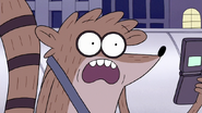 S7E22.169 Rigby Looking at His Cell Phone